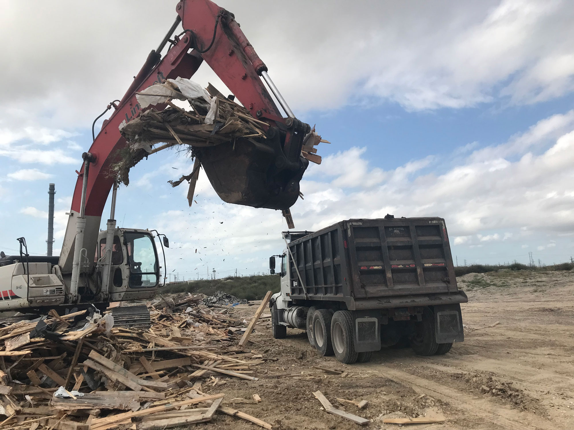 excavator-loading-demo-trash